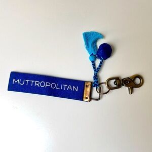 Dog lover keychain. ‘Muttropolitan.’ Antique brass clip.‎ Pompoms.